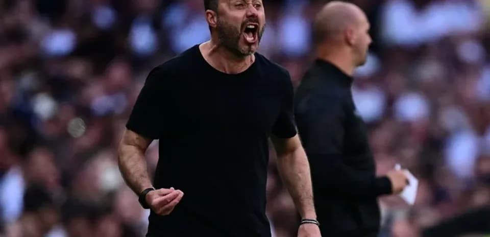 Coach celebrating passionately during a match