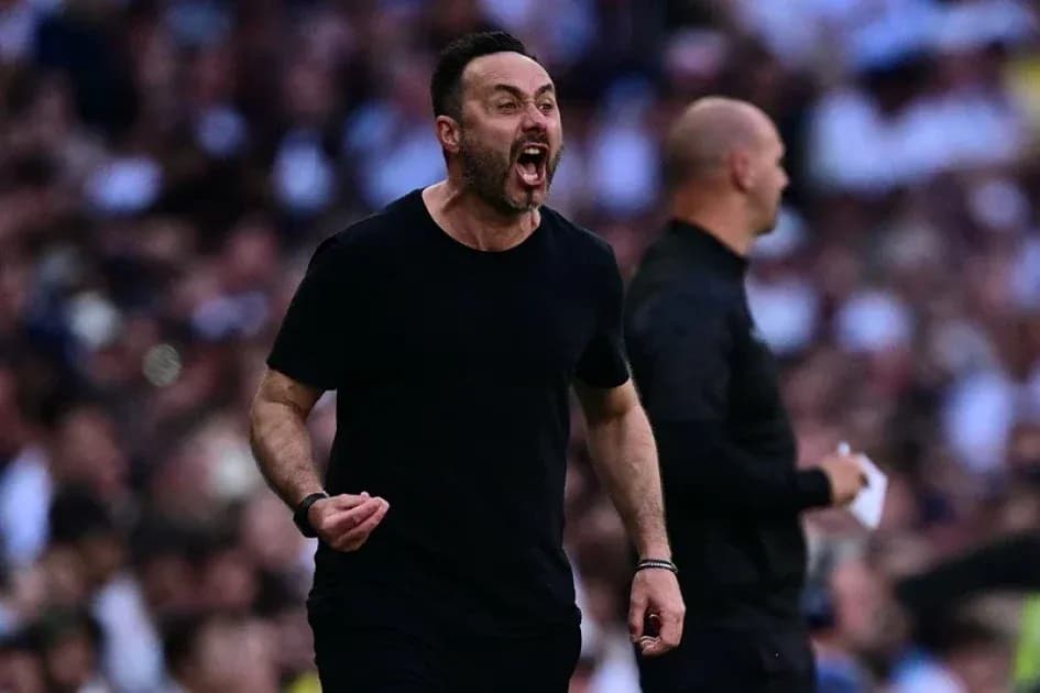 Coach celebrating passionately during a match