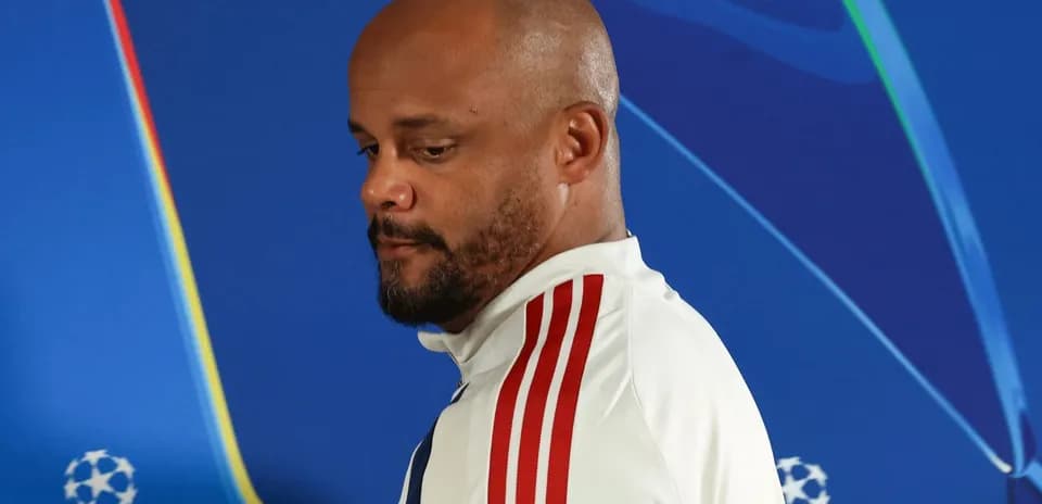 Man in white jacket with red stripes at event
