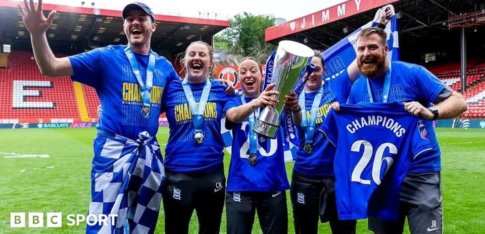 Birmingham City players celebrating with trophy and medals