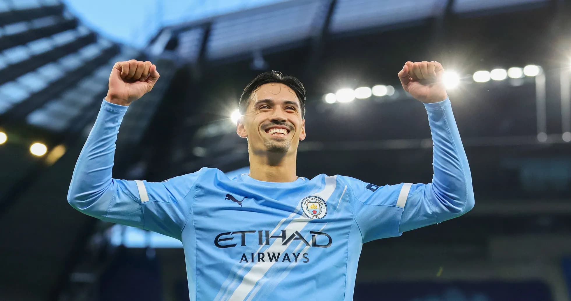 Player celebrating with raised arms at stadium