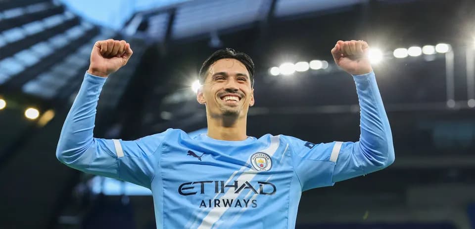 Player celebrating with raised arms at stadium