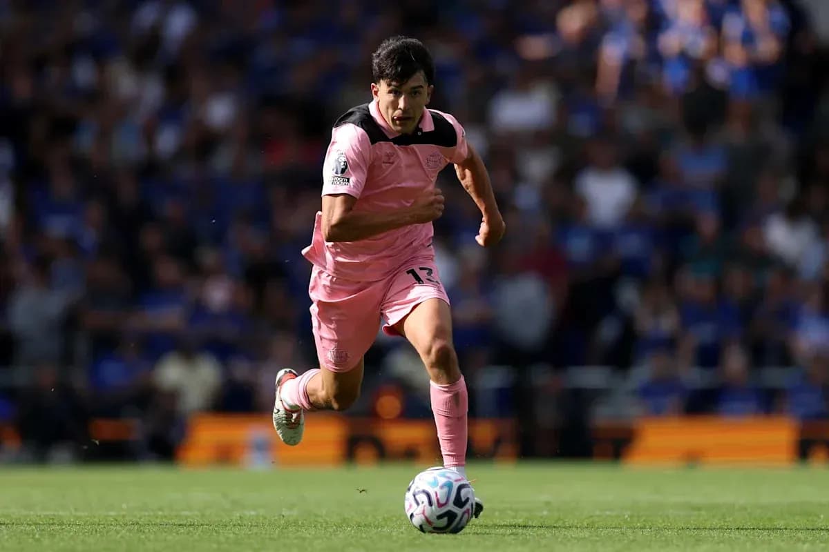 Player sprinting towards the ball on the field