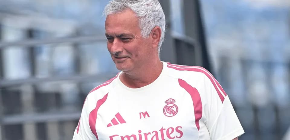 Coach in Real Madrid training kit on the field