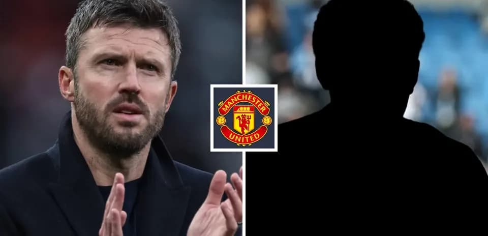 Coach applauding with Manchester United logo displayed