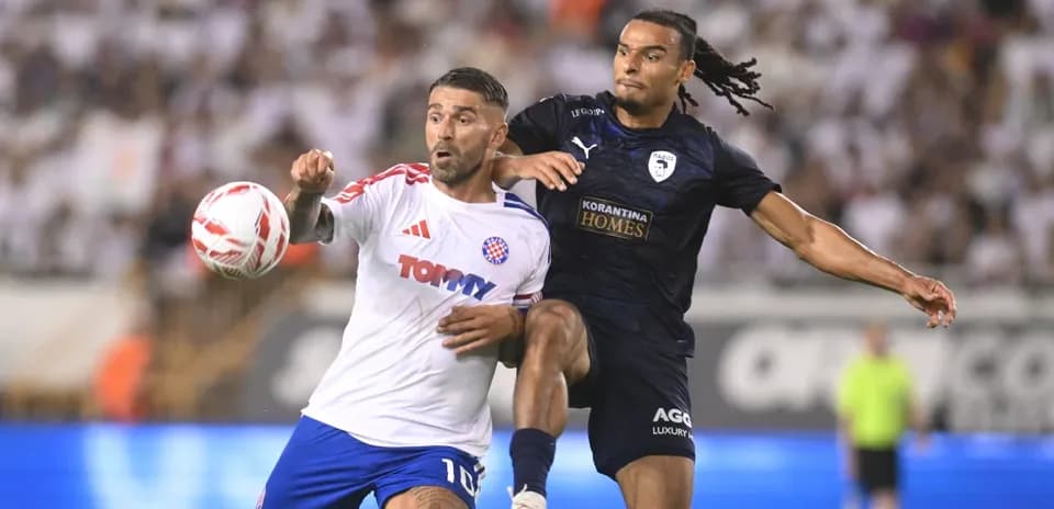 Players competing for the ball in UEFA match