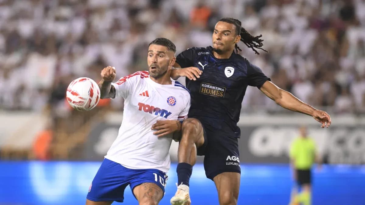 Players competing for the ball in UEFA match