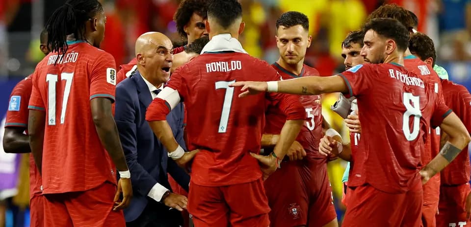 Portugal team discussing strategy during match