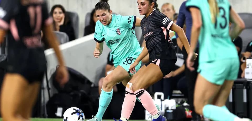 Players competing for the ball during match