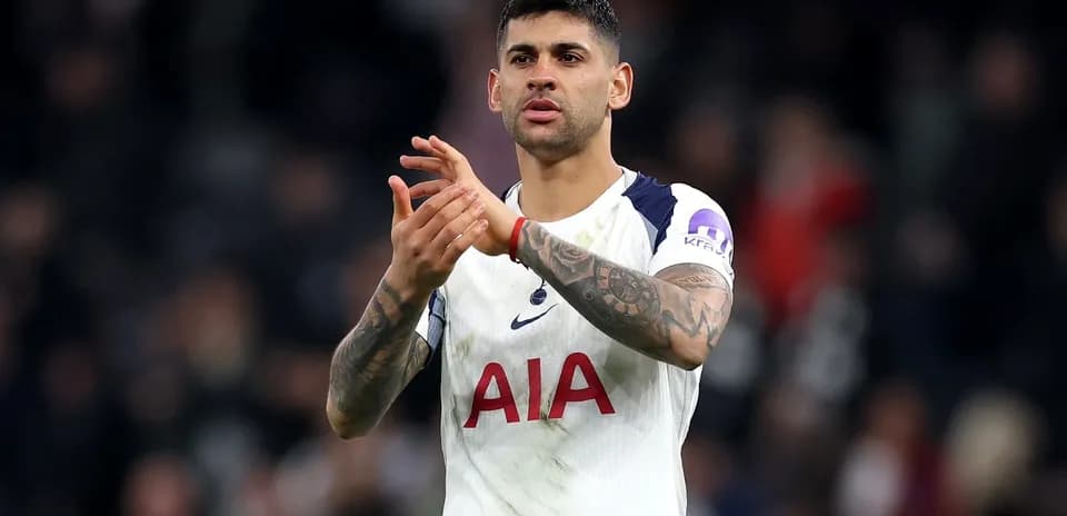 Player applauding fans after match in stadium