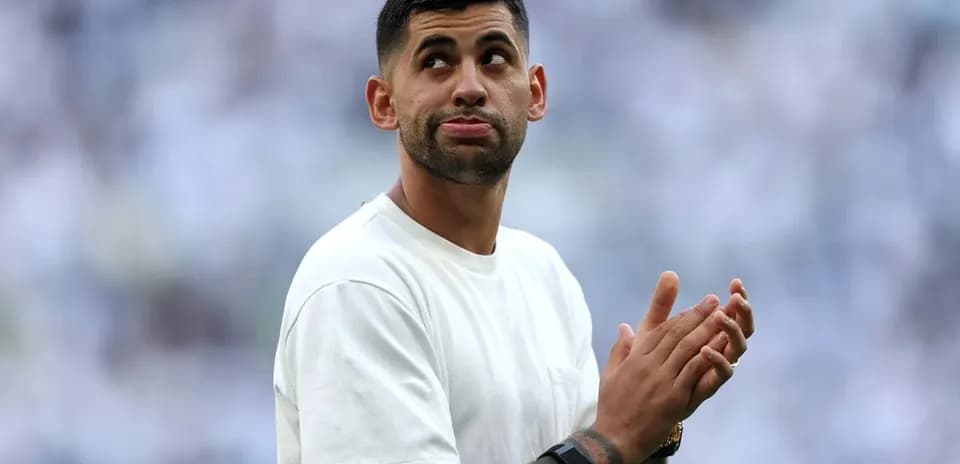 Player clapping hands on the field during match