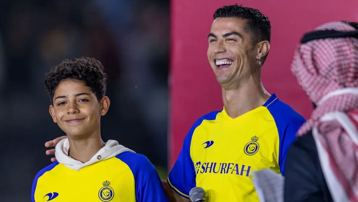 Cristiano Ronaldo smiling with a young fan