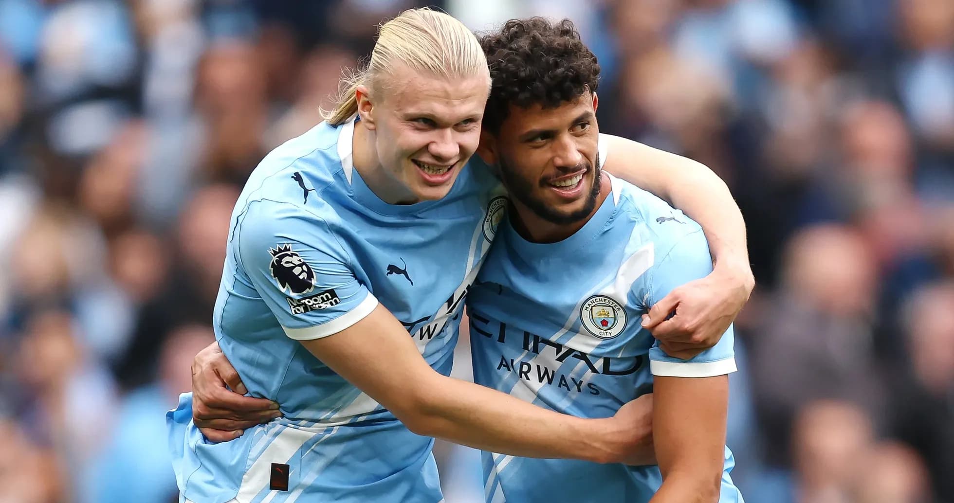 Players celebrating a goal for Manchester City