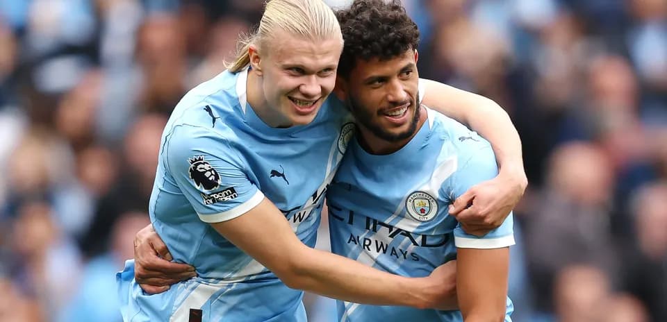Players celebrating a goal for Manchester City