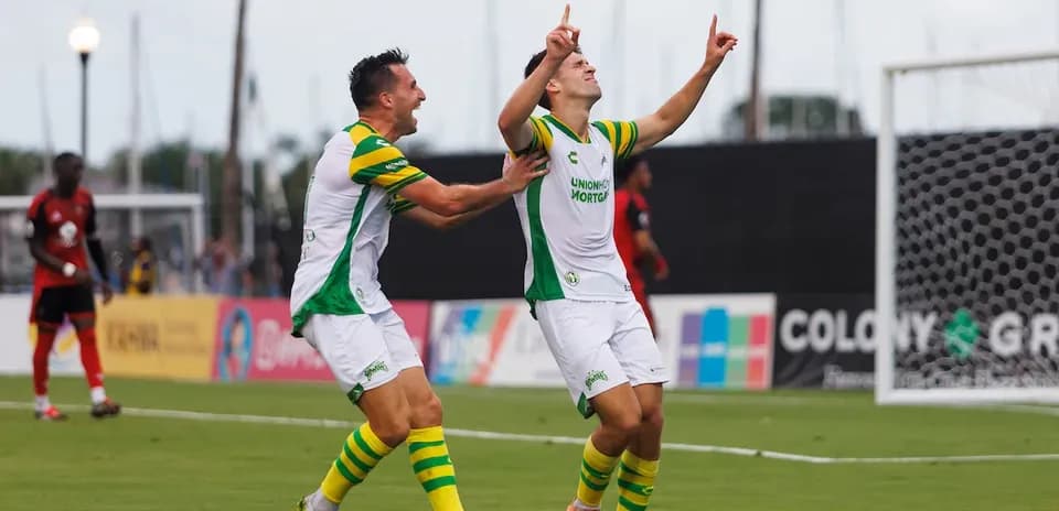 Players celebrating a goal during a match