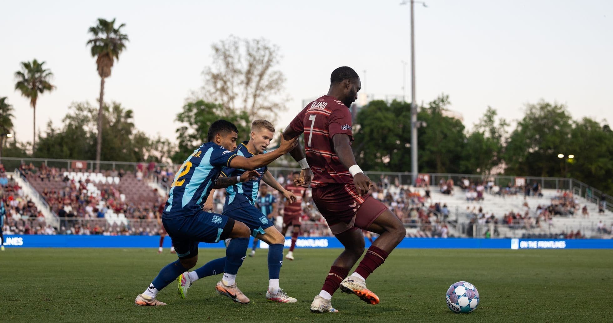 Players competing for the ball during match