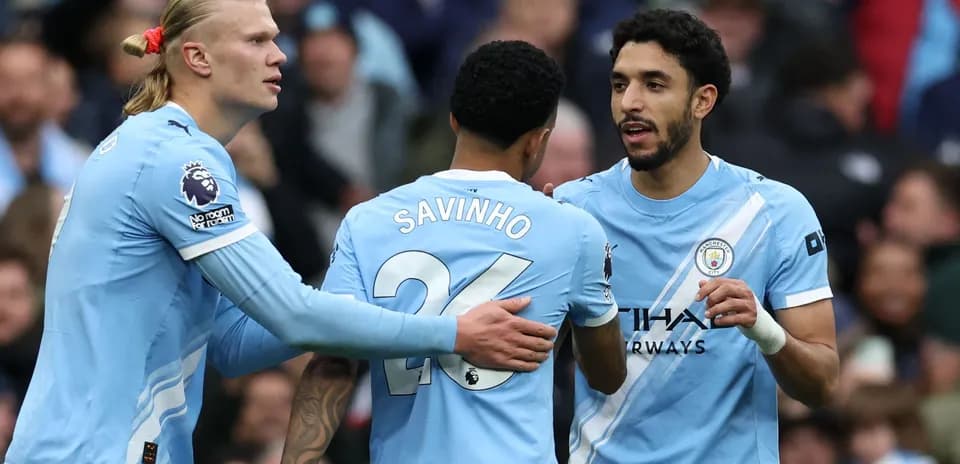 Manchester City players celebrating during match