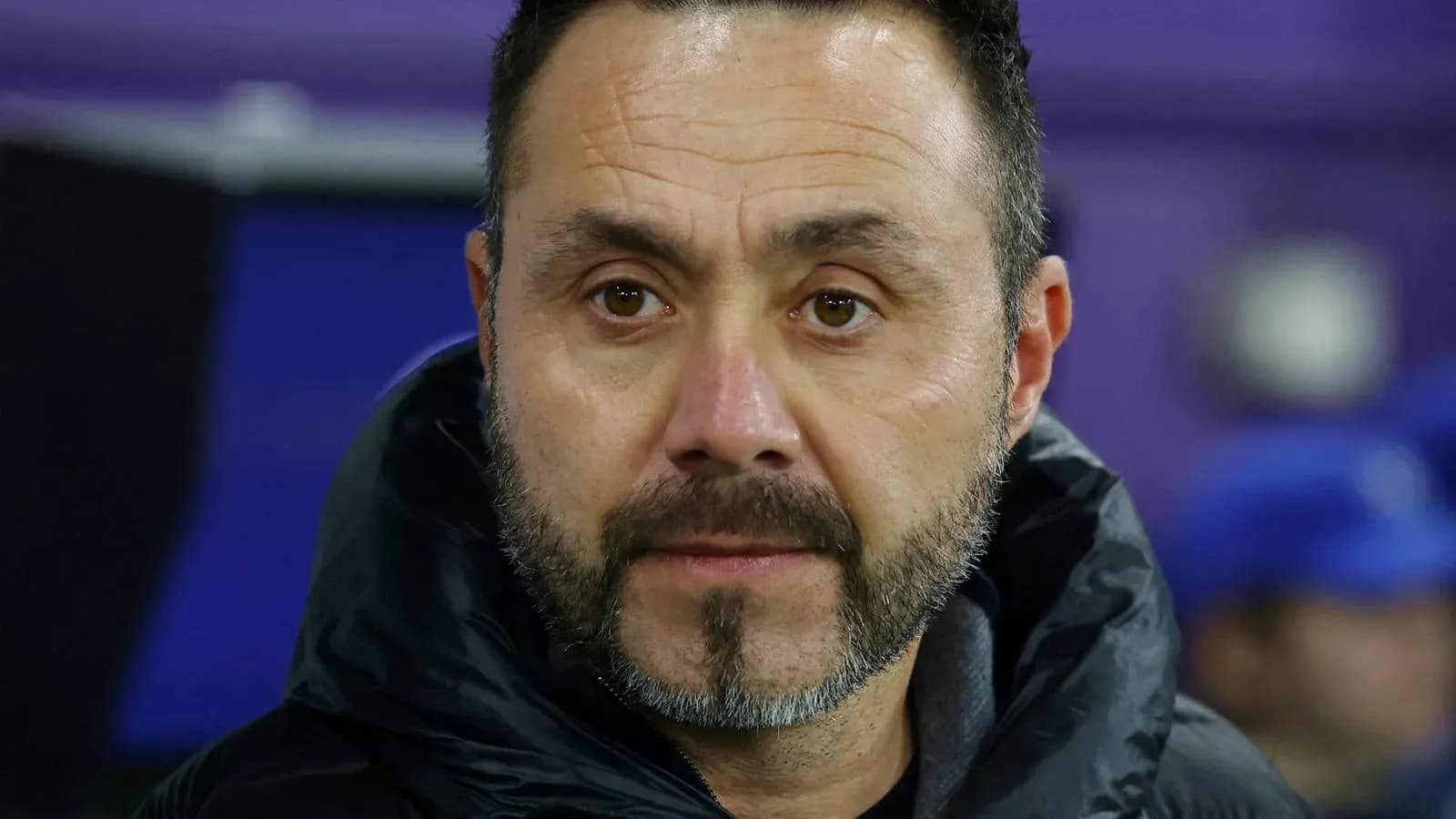Coach observing the match from the sidelines