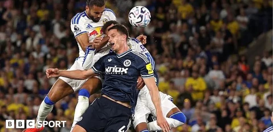 Players challenging for the ball during a match