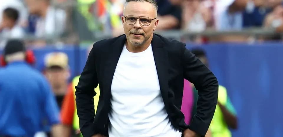 Coach on the sidelines during a match
