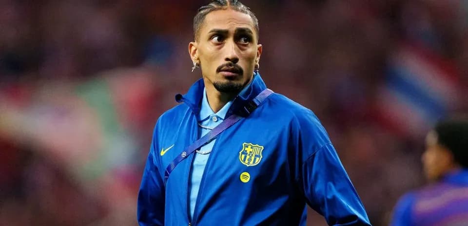 Player wearing FC Barcelona jacket on the field