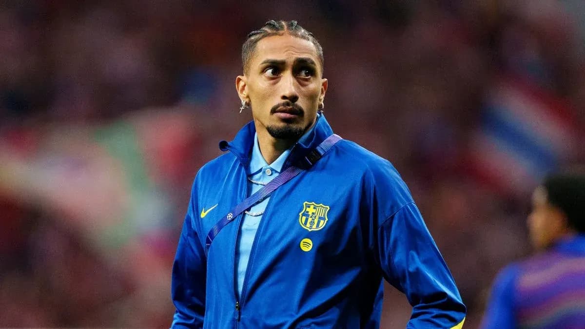 Player wearing FC Barcelona jacket on the field