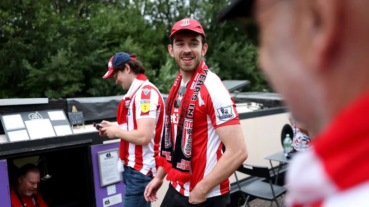 Fans wearing team jerseys at a sporting event