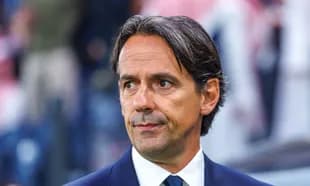 Coach observing match from the sidelines