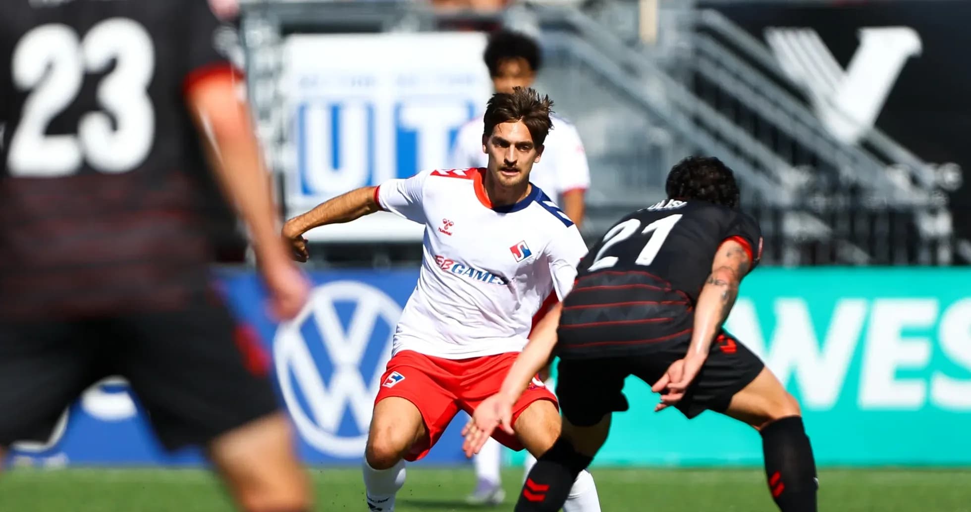 Player dribbling during Vancouver FC match