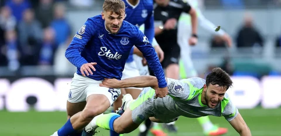 Everton player tackling Manchester City opponent