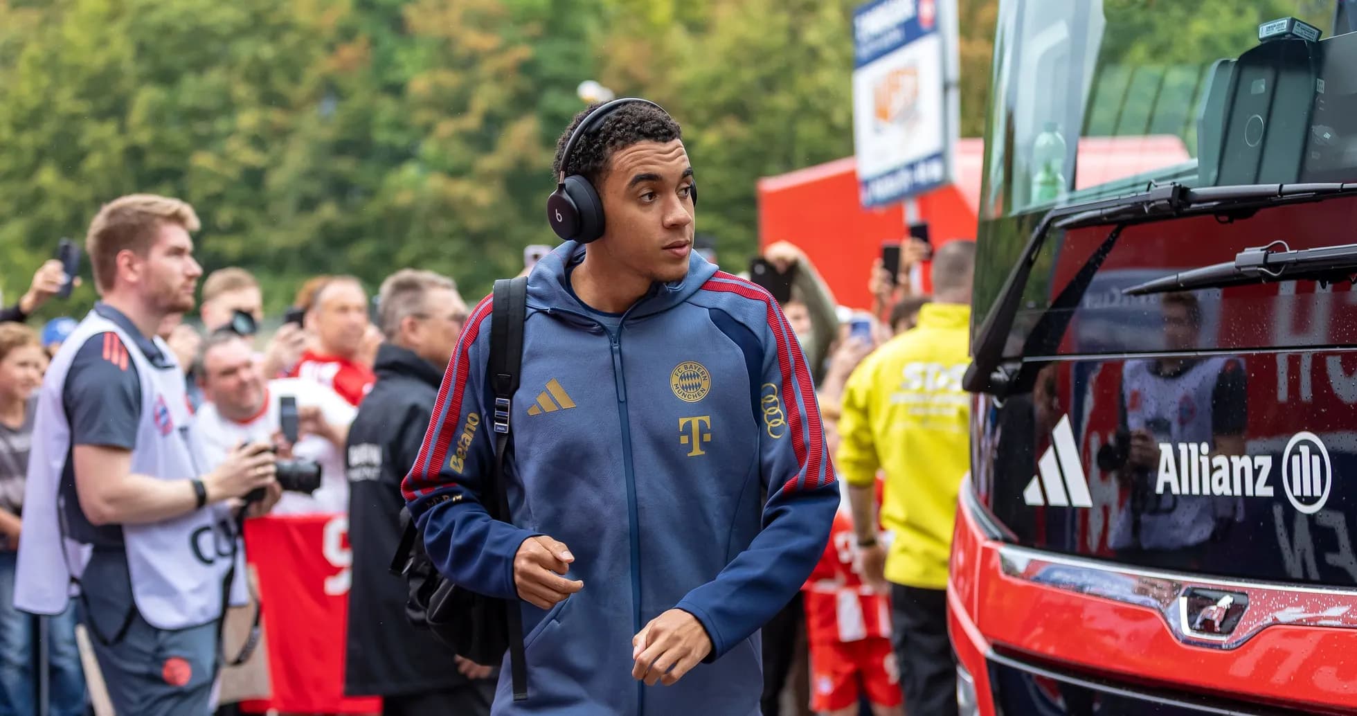 Player arriving at stadium with team bus