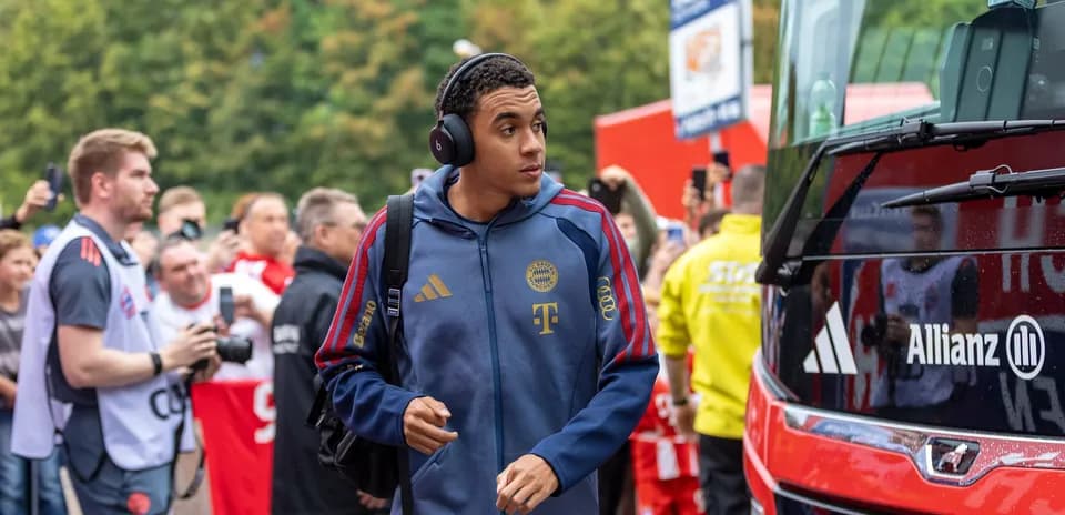 Player arriving at stadium with team bus