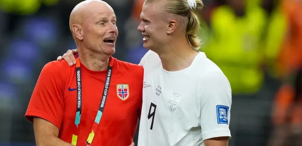 Coach and player celebrating after match together