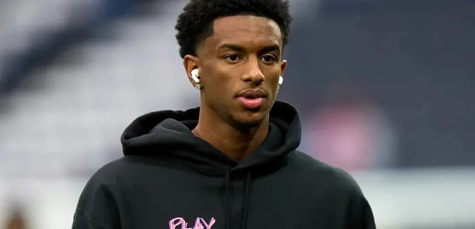Player wearing headphones before the match