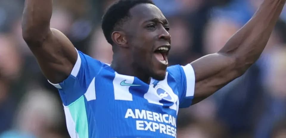 Player celebrating a goal in blue team jersey
