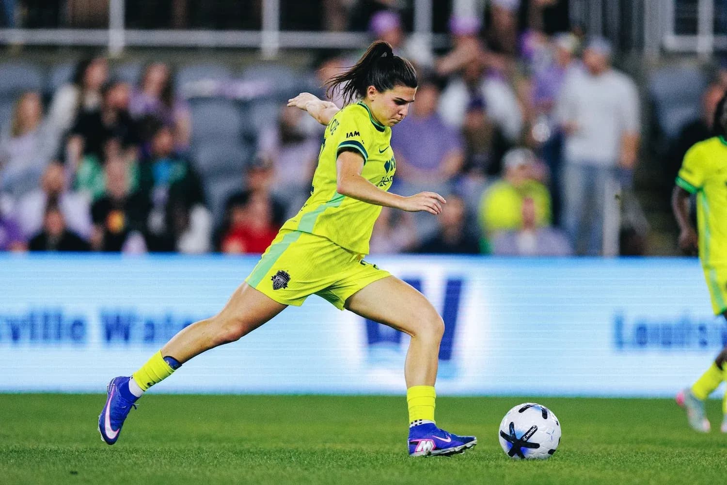 Player kicking the ball during NWSL match