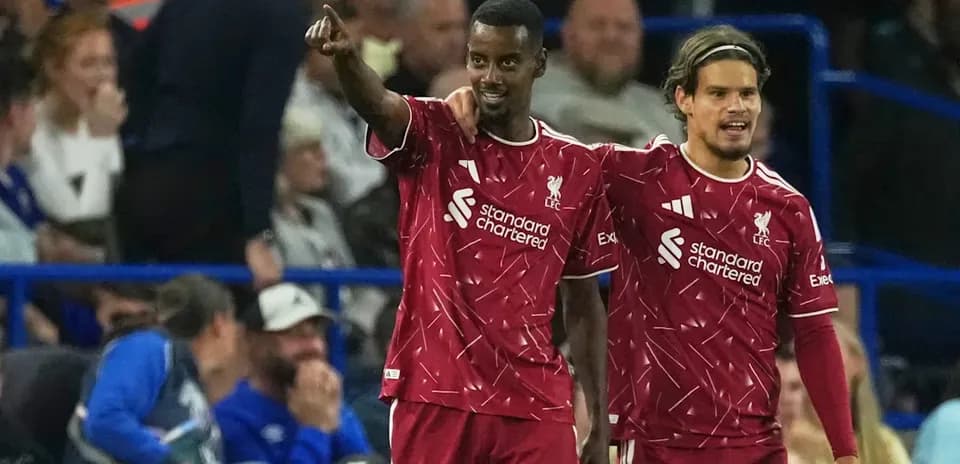 Liverpool players celebrating a goal on the pitch