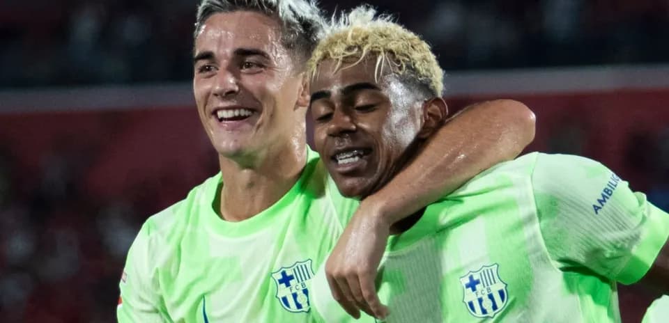 Two players celebrating together after a match