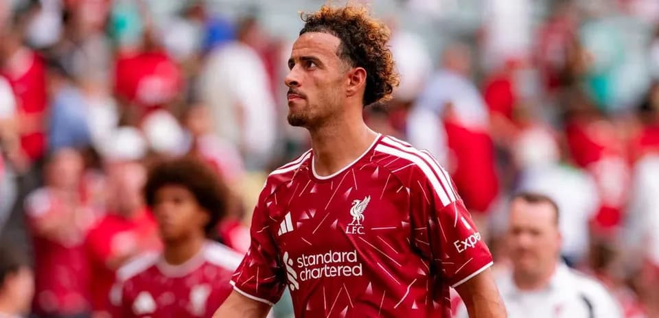 Liverpool player walking off the pitch after match