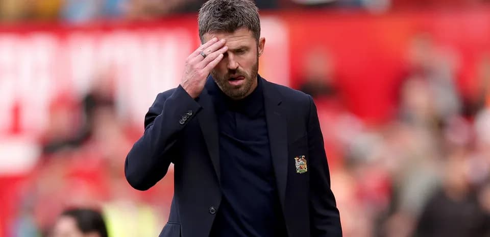 Manager walking on pitch during match with concern