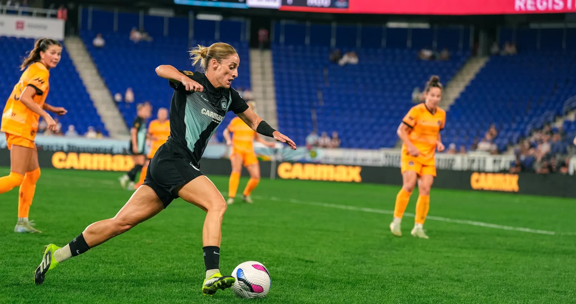 Player dribbling the ball during NWSL match