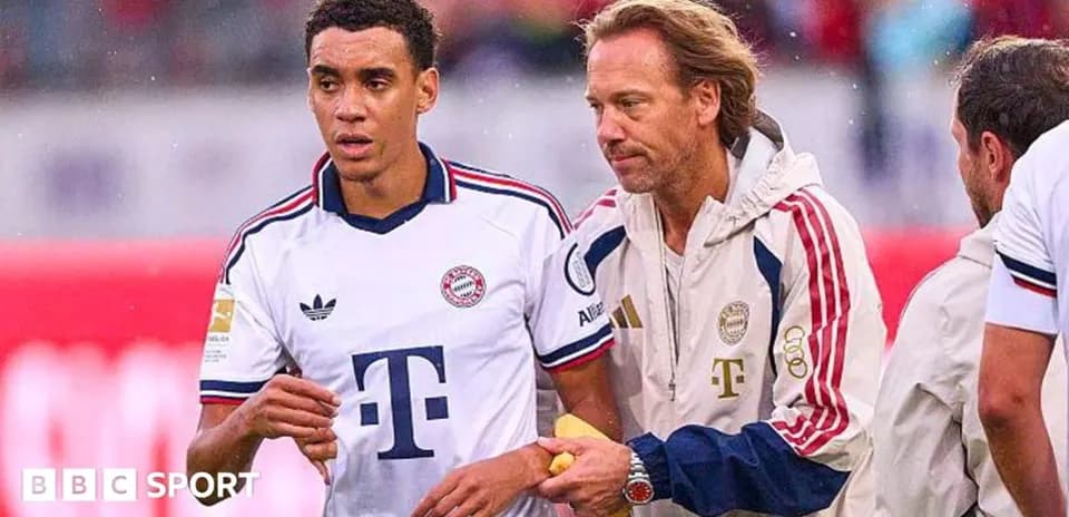 Player receiving medical attention on the sidelines