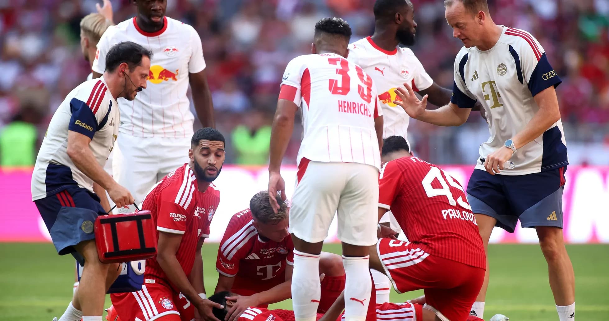 Players and medical staff attending to an injured player