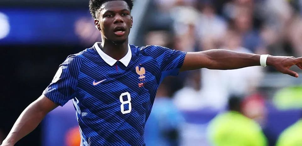 Player gesturing during match in blue jersey