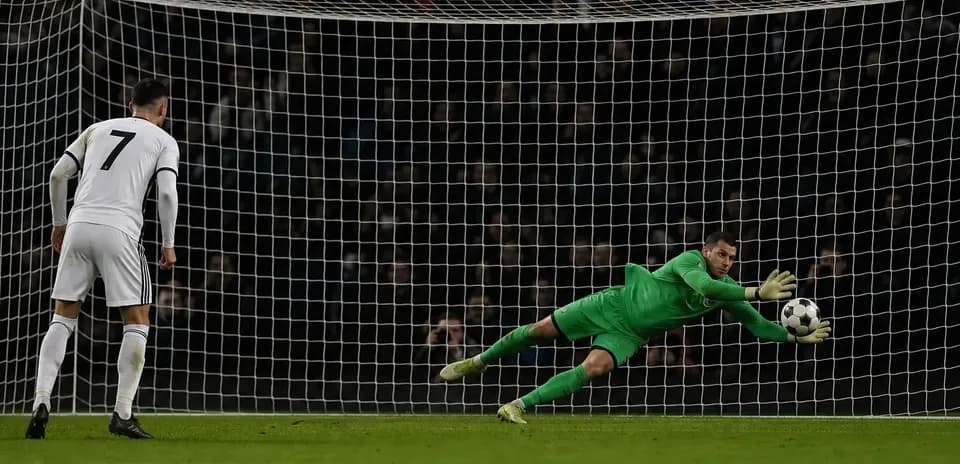 Goalkeeper diving to save a penalty kick