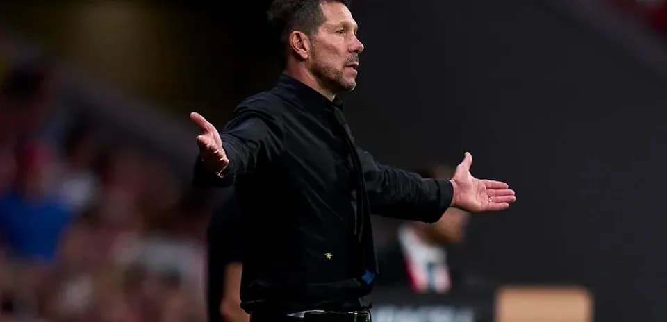 Coach gesturing during a match from the sidelines