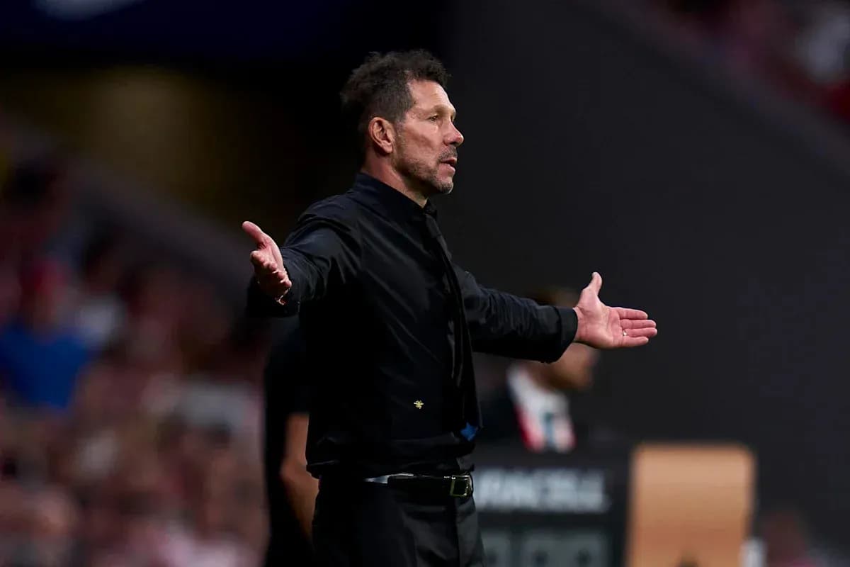 Coach gesturing during a match from the sidelines