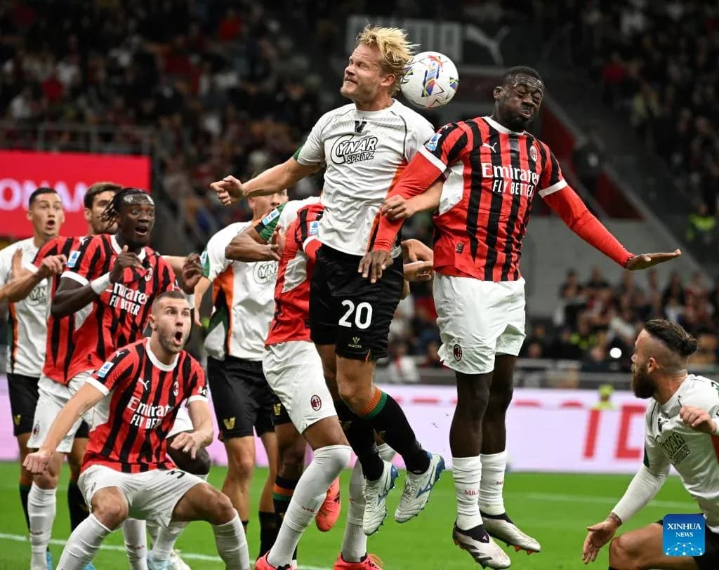 Players contesting for the ball during AC Milan match Players contesting for the ball during AC Milan match