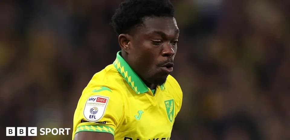 Player in yellow kit running during match