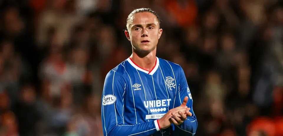 Player applauding fans in Rangers jersey